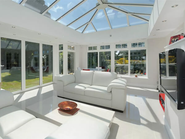 A light-filled glass roof conservatory